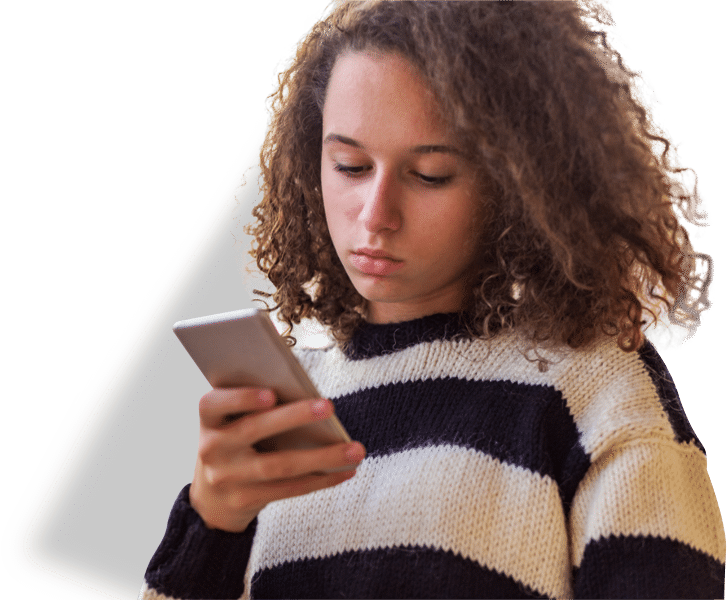 anxious teen girl looking at phone