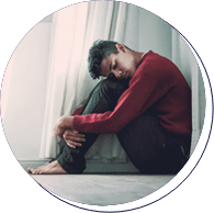 young man sitting on floor with anxiety
