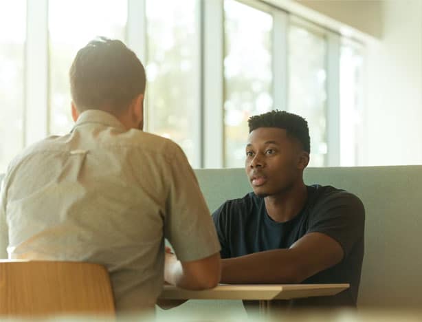 young man and counselor discussing depression