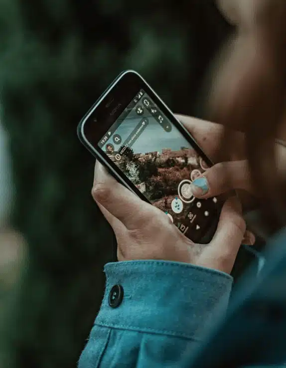 a teen holding a smartphone