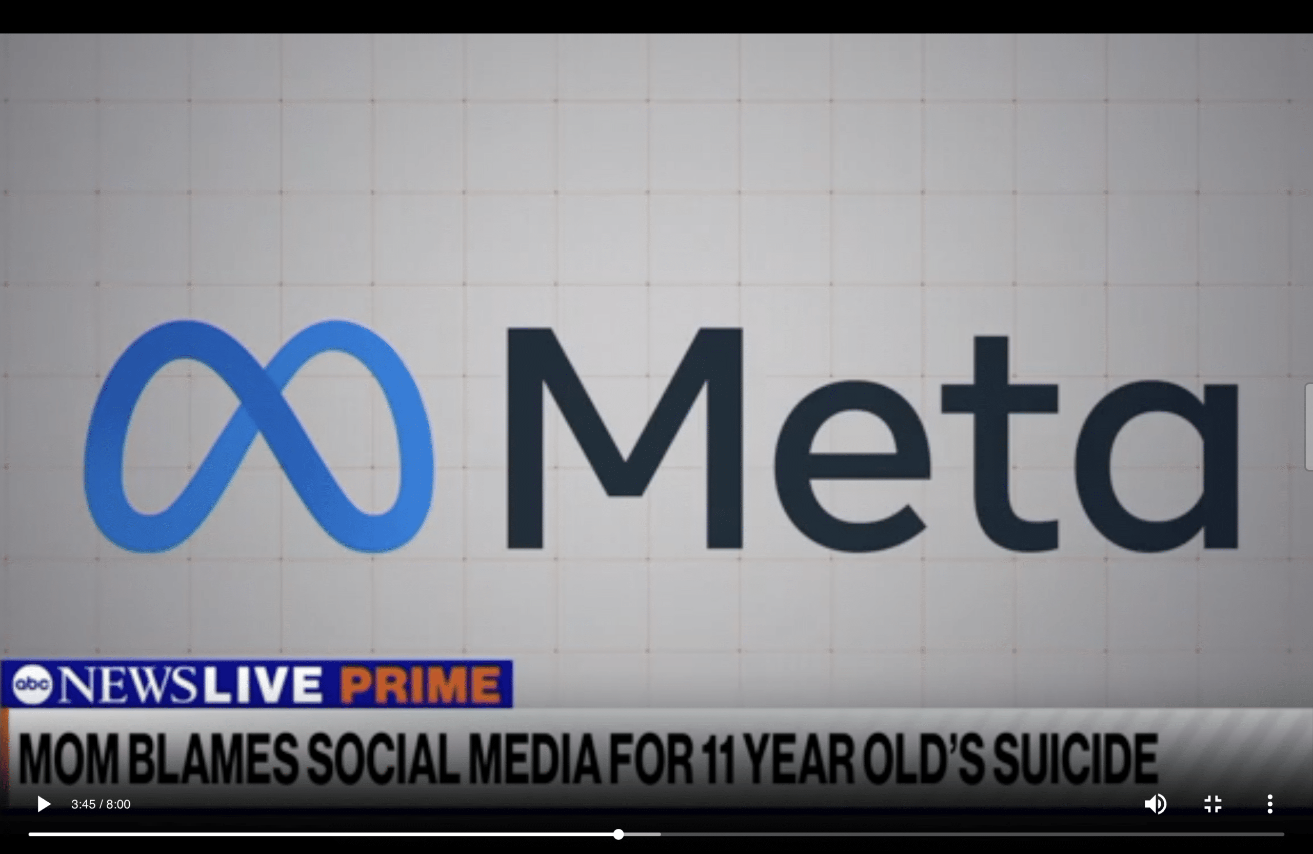 a photo of the Meta logo on a news clip from abc news talking about a child who committed suicide and parents blame the platform