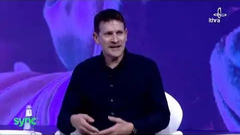 a man talking at a Sync Digital Well Being Summit
