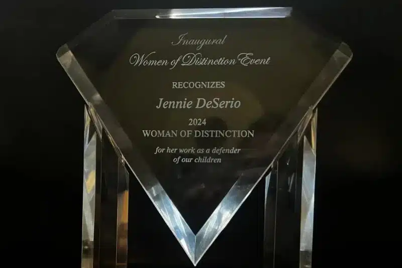 award given to jennie deserio 2024 women of distinction event