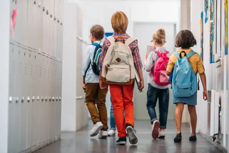 kids walking inside a school