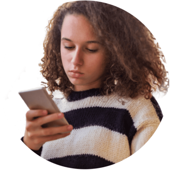 Teen girl looking at cell phone